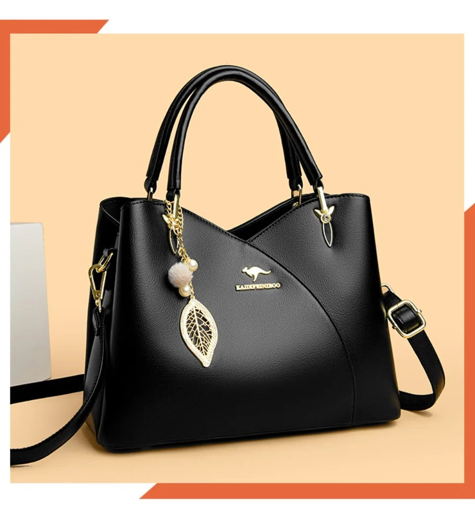Elegant black shoulder bag with stylish charms