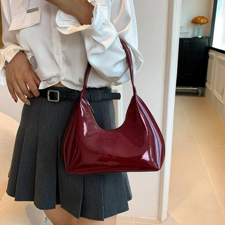 Elegant burgundy shoulder bag with a patent finish