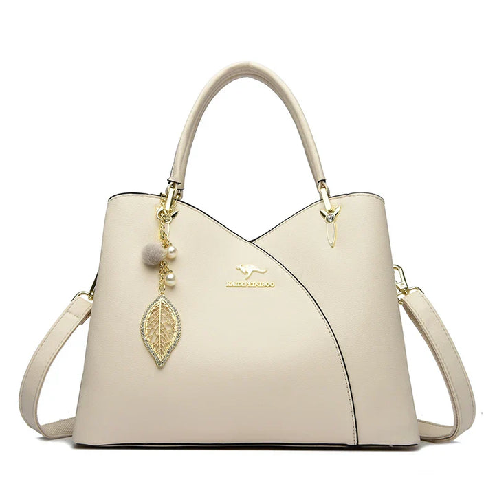 Elegant black shoulder bag with stylish charms