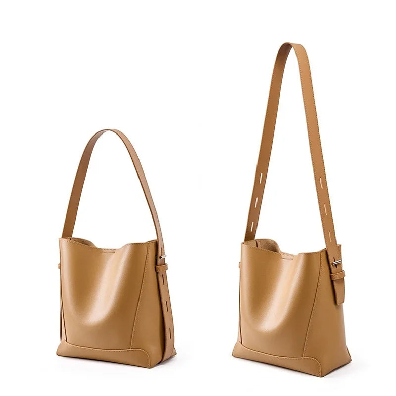 tine™ – Elegant shoulder bag in a sandy shade with strap-inspired handles
