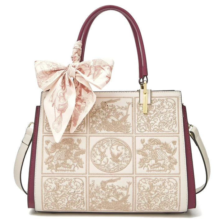 Sylvia™ – Unique crossbody bag with embroidery and bow