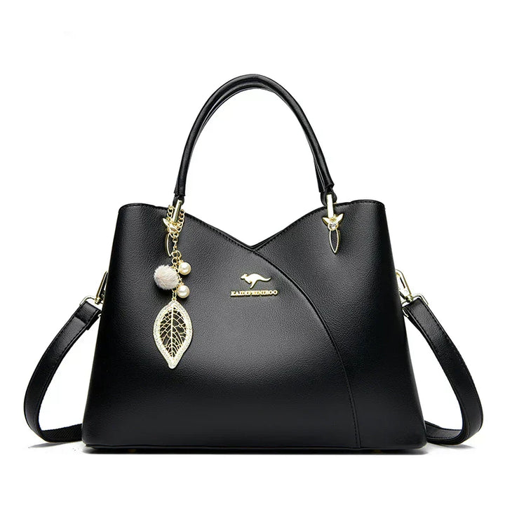 Elegant black shoulder bag with stylish charms