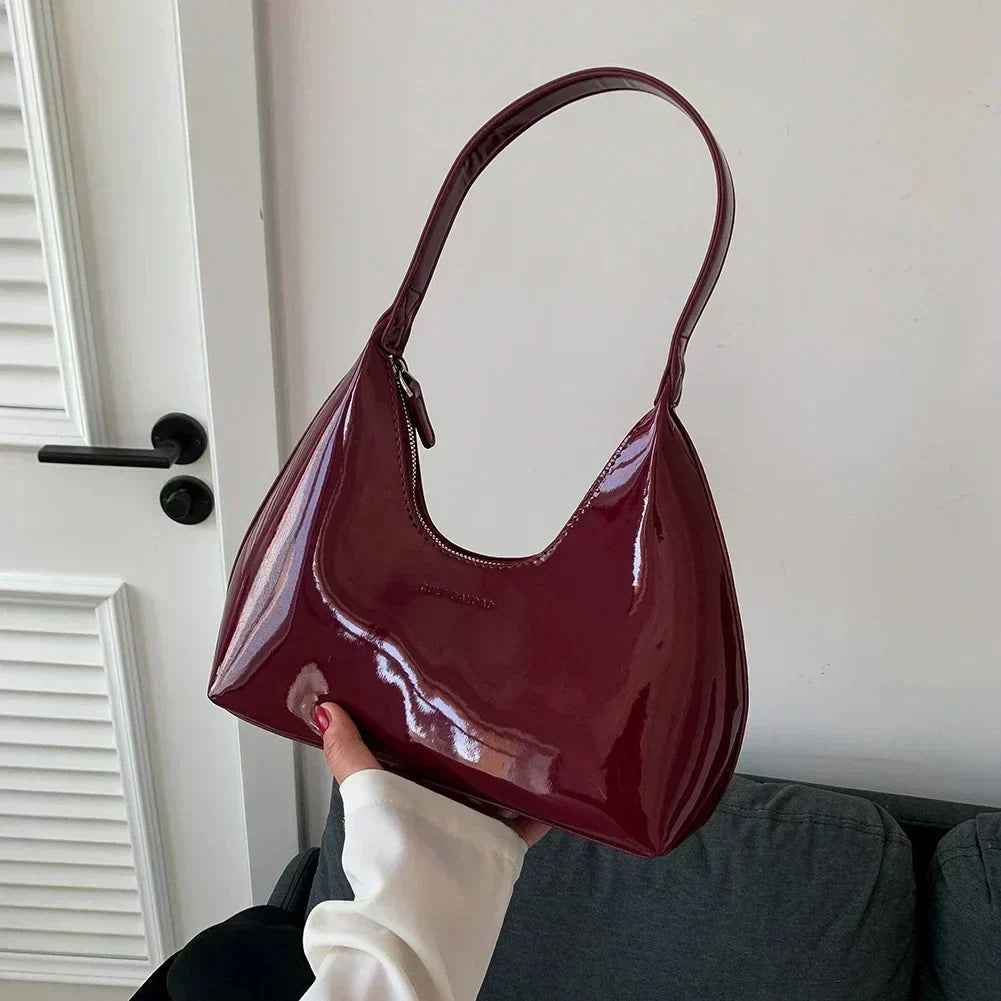 Elegant burgundy shoulder bag with a patent finish