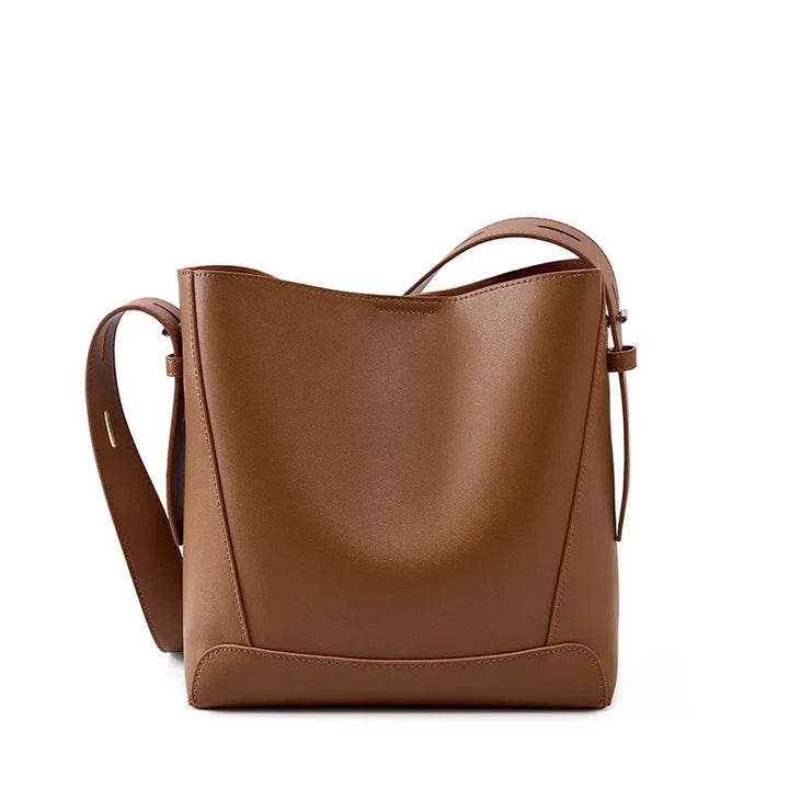 tine™ – Elegant shoulder bag in a sandy shade with strap-inspired handles