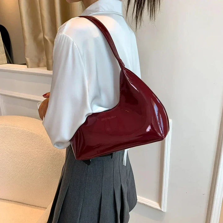 Elegant burgundy shoulder bag with a patent finish