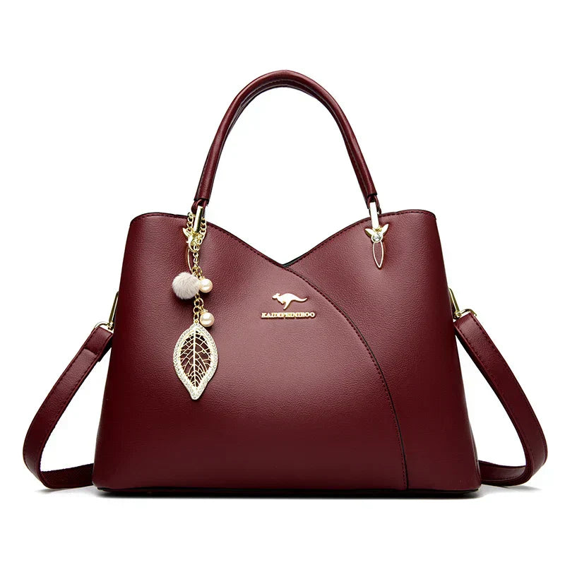 Elegant black shoulder bag with stylish charms